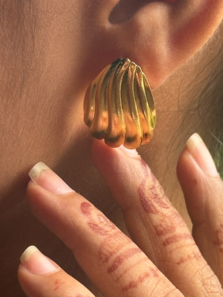 Avanika Shell-shaped Gold Stud Earrings close-up